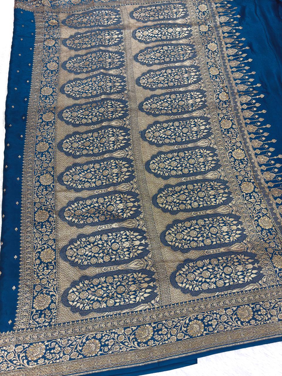 Teal Blue Khaddi Crepe Georgette Saree with Embossed Diamond Jaal and Architectural Paisley Pallu
