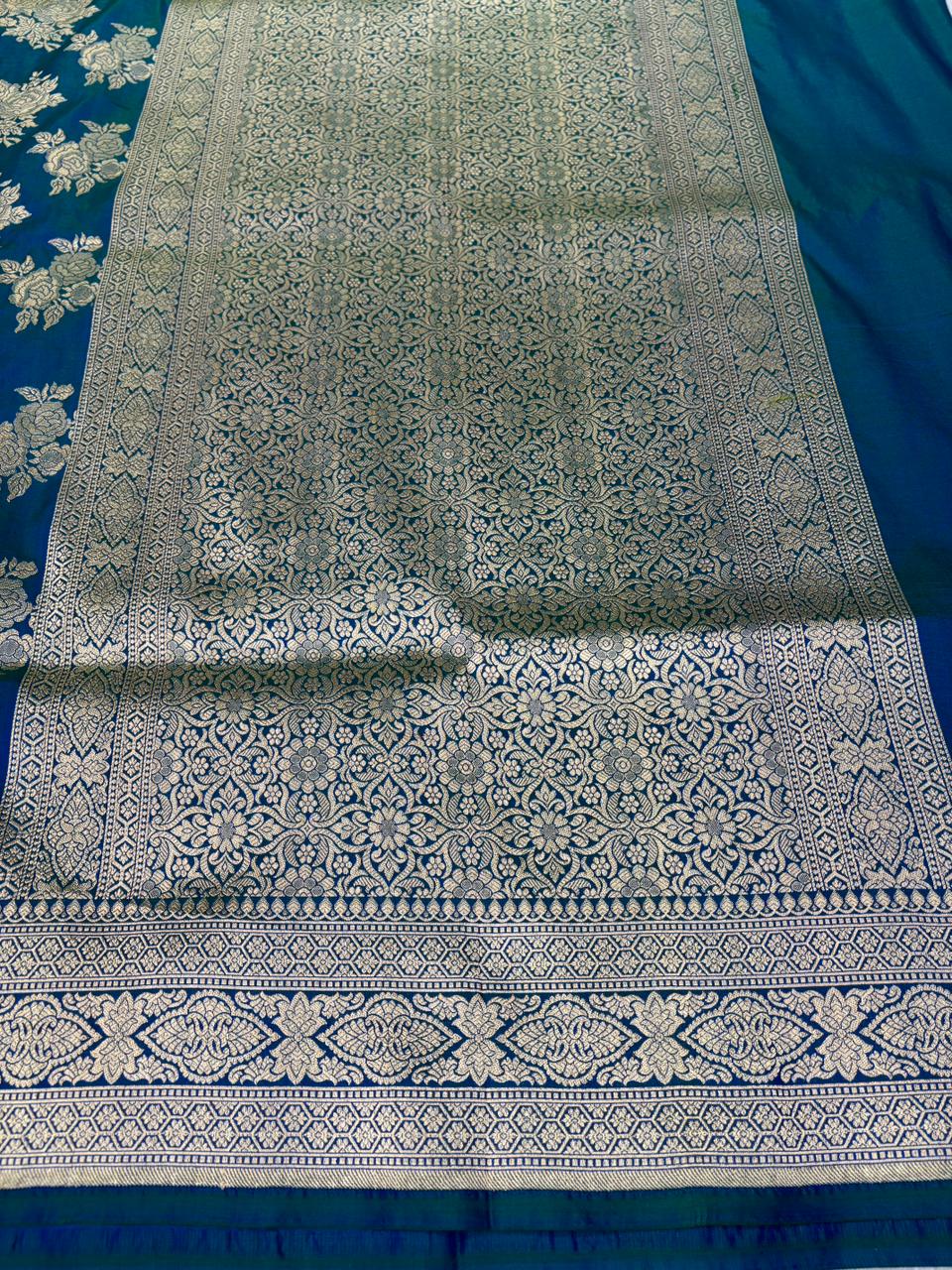 Enchanting Peacock Blue Banarasi K atan Jungla Cutwork Saree with Antique Zari Floral Bunches