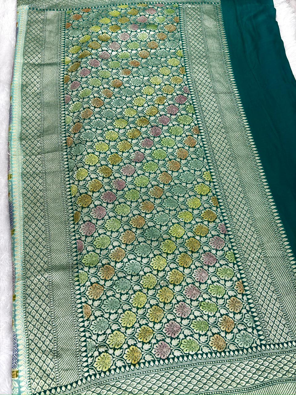 Refreshing Teal Blue Khaddi Georgette Handloom Saree with Multi-Color Geometric Jaal